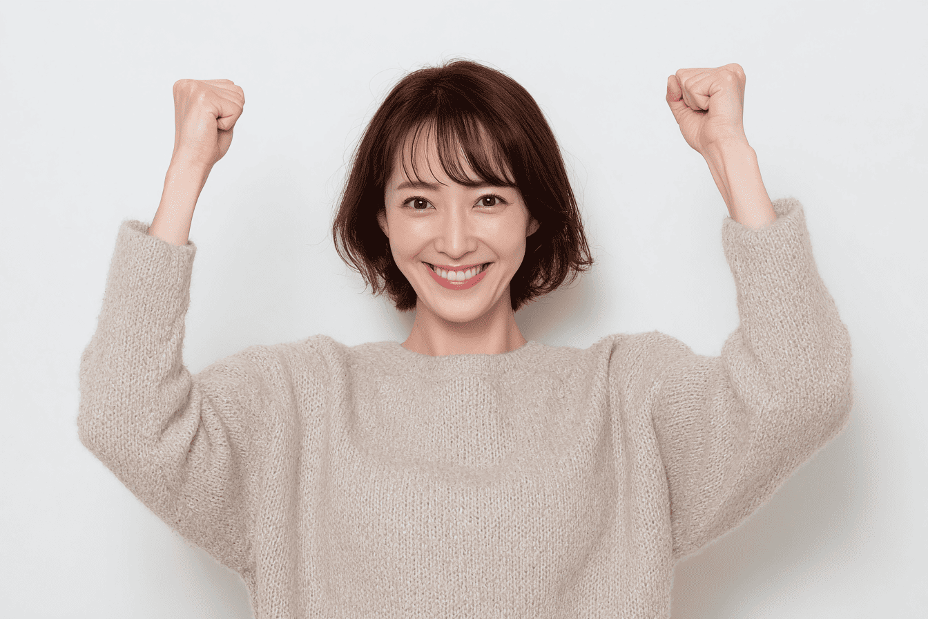 ガッツポーズする女性